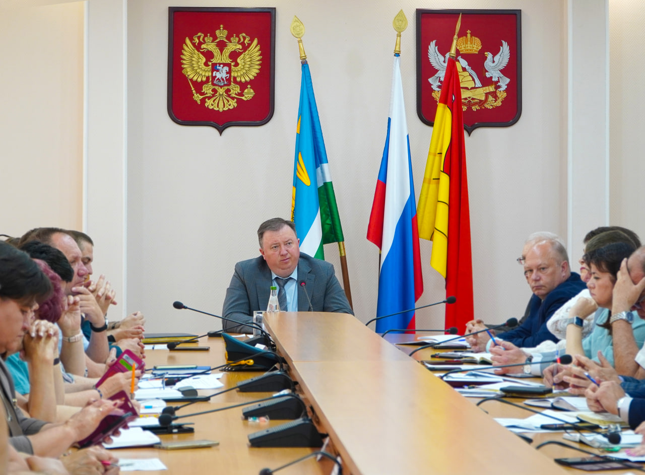 В администрации района.