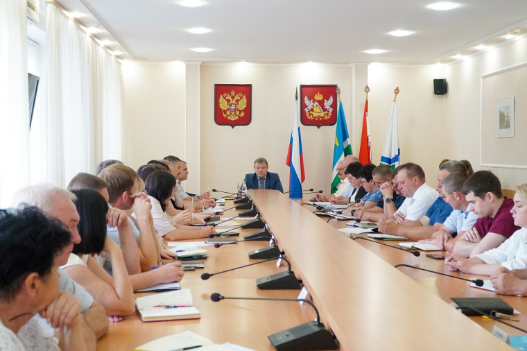 В администрации района. В администрации района.